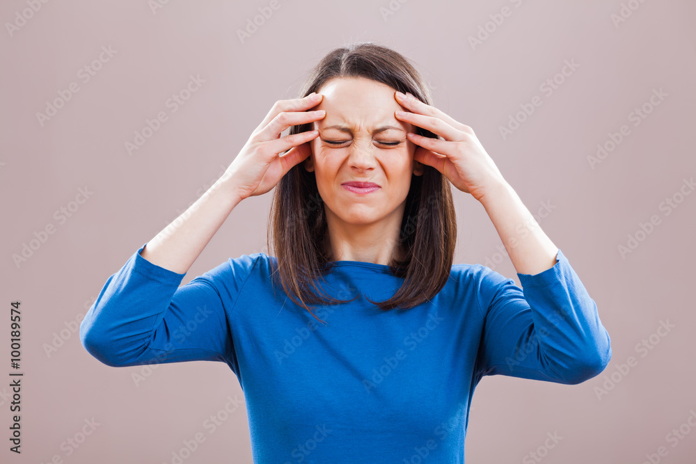 Portrait of young woman who is having headache. Portrait of young woman who is having headache.