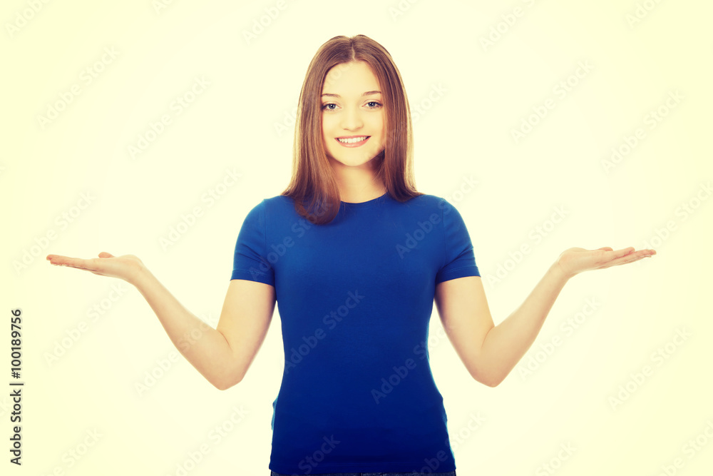Smiling woman showing something on palms. Smiling woman showing something on palms.