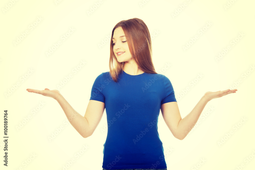 Smiling woman showing something on palms. Smiling woman showing something on palms.