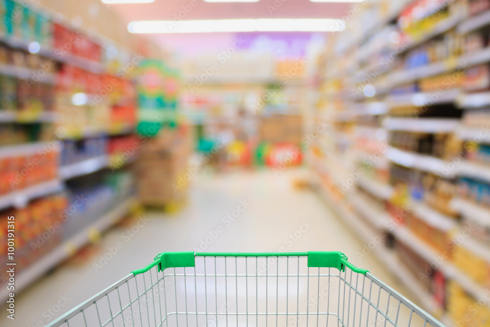 Supermarket interior with shopping cart Supermarket interior with shopping cart