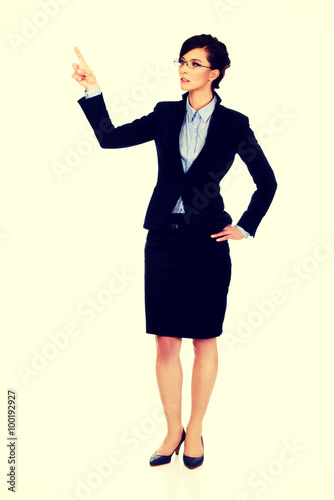 Businesswoman pointing up.
