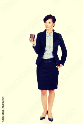 Businesswoman with coffee cup.