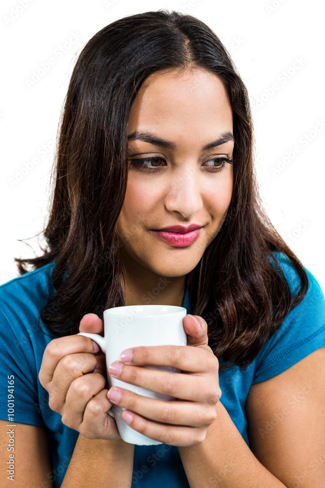 Thoughtful woman holding coffee cup Thoughtful woman holding coffee cup