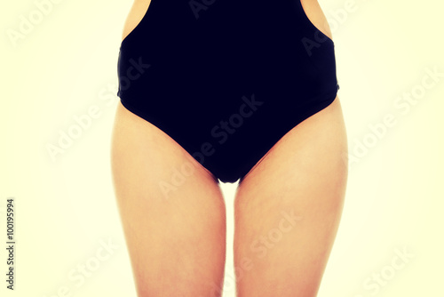 Woman's body in swimsuit.