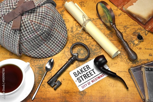 Sherlock Holmes Deerstalker Cap And Other Objects On Old Map photo