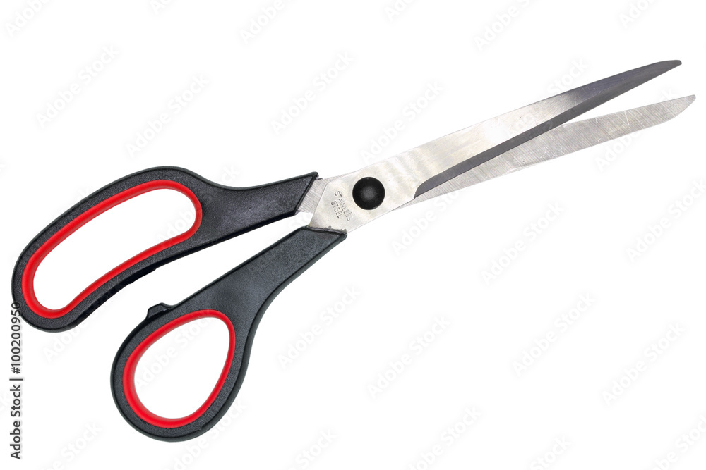 Single red-black steel scissors. Isolated on white background. Close-up. Studio photography. Single red-black steel scissors. Isolated on white background. Close-up. Studio photography.