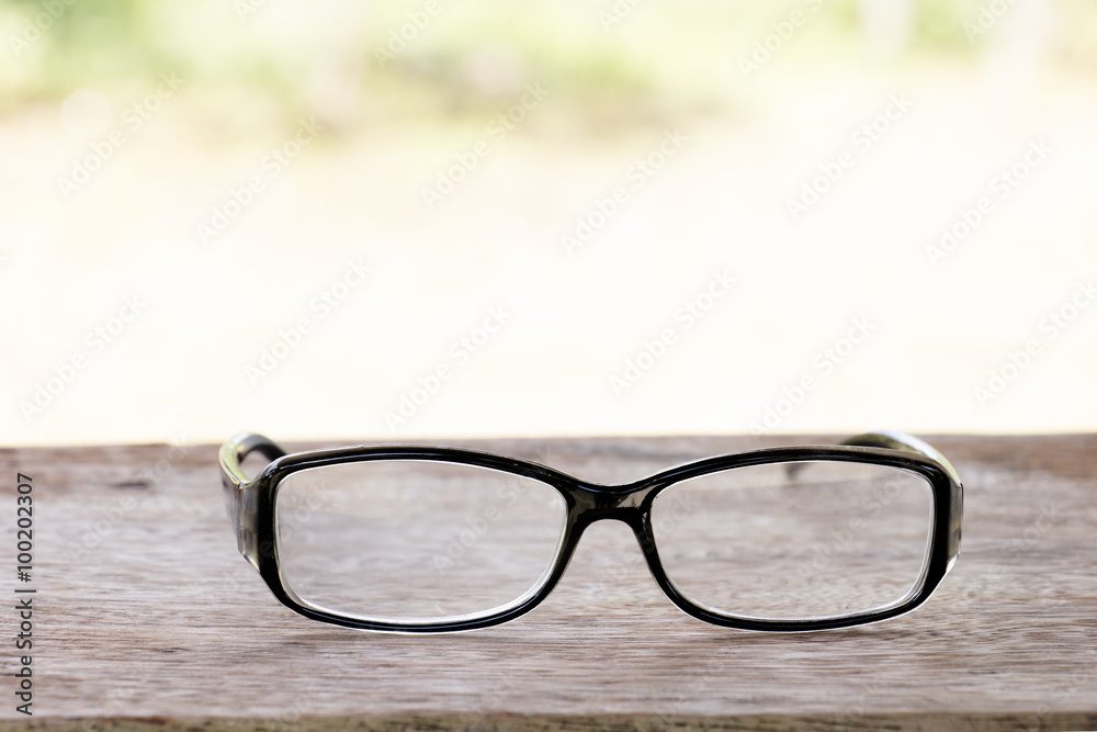 black glasses on old  wood table