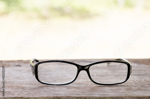 black glasses on old wood table