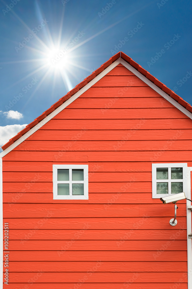 surveillance Cameras on red house with sunlight sky surveillance Cameras on red house with sunlight sky