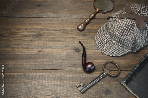 Sherlock Holmes Concept. Private Detective Tools On The Wood Tab photo