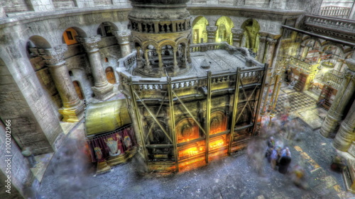 Panning shot of Shot of the Edicule of the Holy Sepulchral time-lapse of tourists walking around. photo