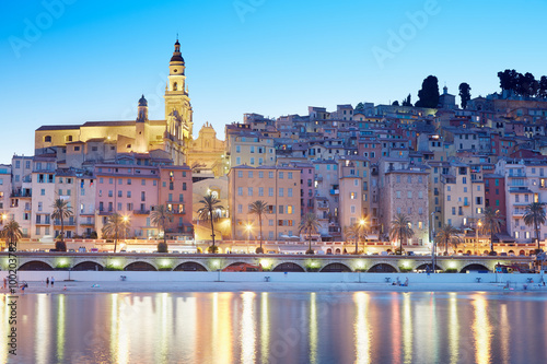 Menton  old city illuminated in the evening  light reflections