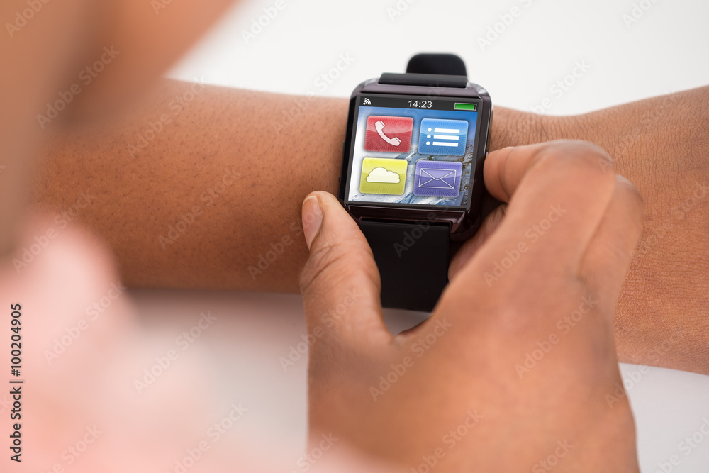 Person's Hand Wearing Smartwatch Person's Hand Wearing Smartwatch