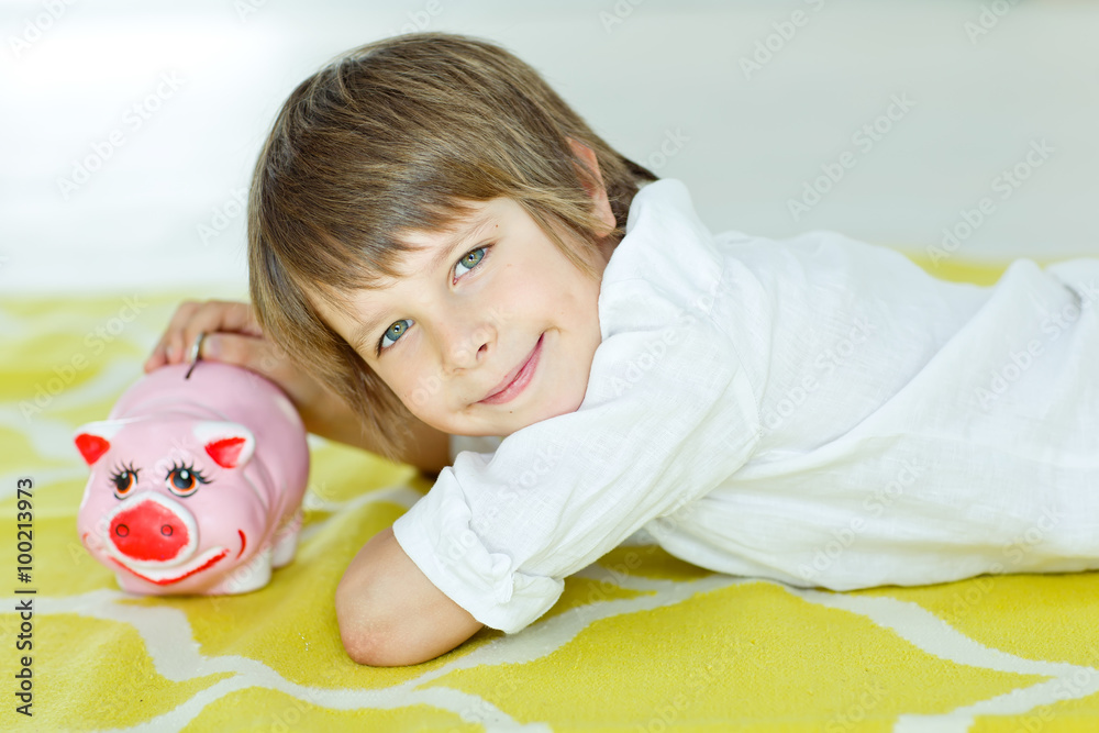 kid with piggy bank 
