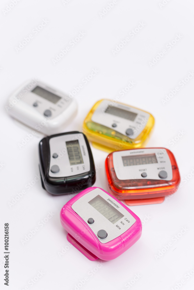 Colorful pedometers over white background Colorful pedometers over white background