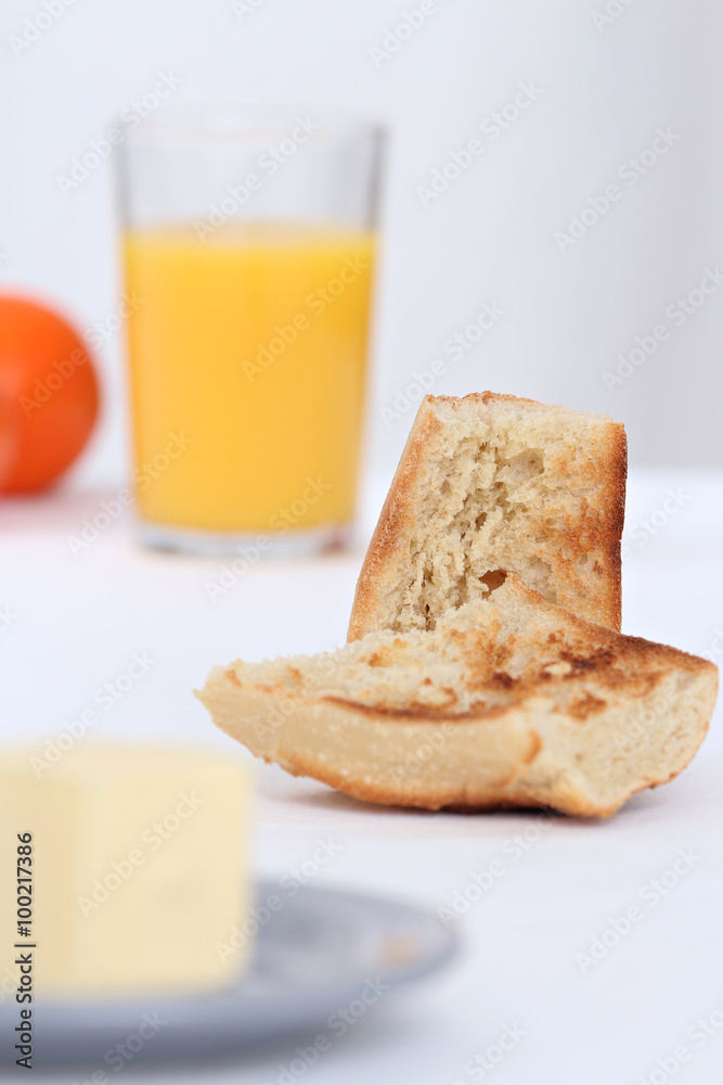 close up of a breakfast with toast and orange juice full of vitamins close up of a breakfast with toast and orange juice full of vitamins