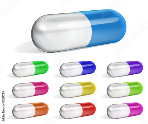 Set of multicolored oblong capsules with shadows on white background