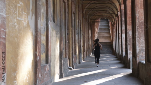 Wallpaper Mural Woman jogging down Italian architecture arcade. Torontodigital.ca