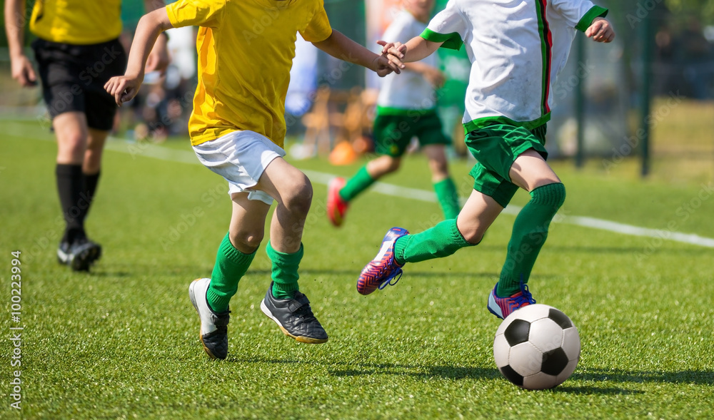 boys playing soccer football match boys playing soccer football match
