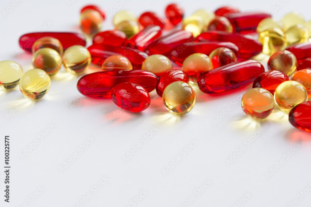 Vitamins scattered on a white background Vitamins scattered on a white background