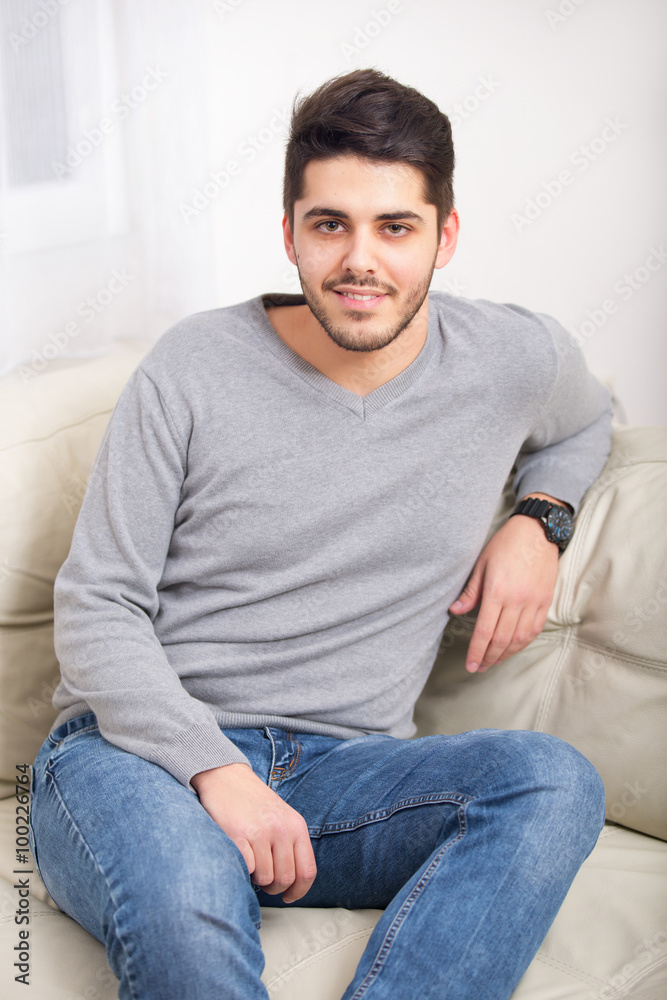Portrait of a Handsome Young Man Looking at the Camera with a Happy Facial Expression Portrait of a Handsome Young Man Looking at the Camera with a Happy Facial Expression