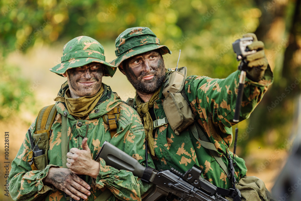 Selfie! group of russian soldiers taking selfie with smartphone