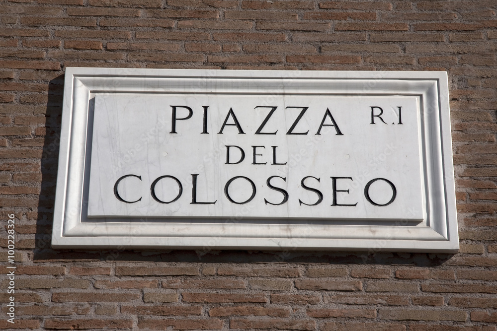 Colosseum Square Sign on Brick Wall in Rome, Italy Colosseum Square Sign on Brick Wall in Rome, Italy