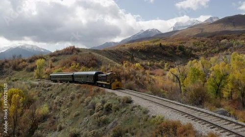 Train Rolling through Scenic Landscape