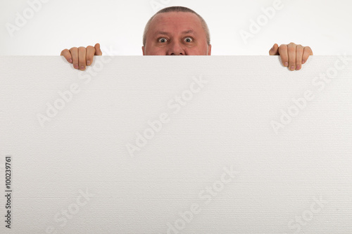 senior peeps over top of blank white paper