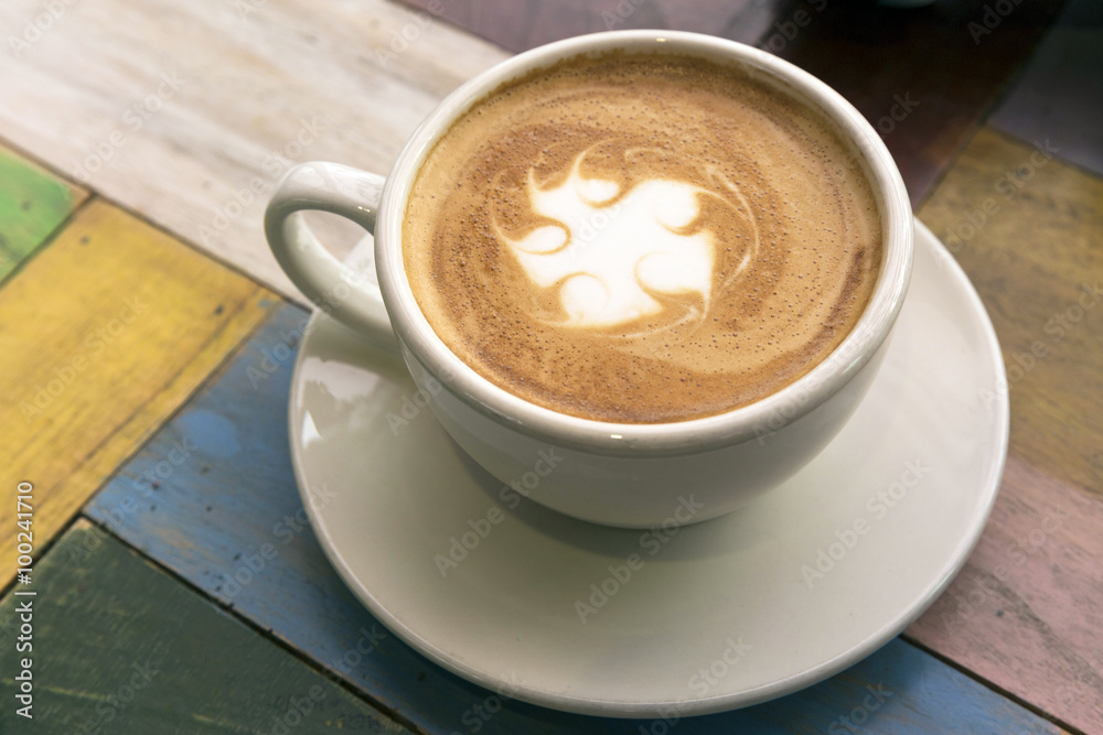 Two Cups of coffee with latte art on wooden table Two Cups of coffee with latte art on wooden table