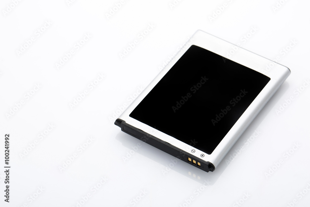 Swollen old battery on background Swollen old battery on background