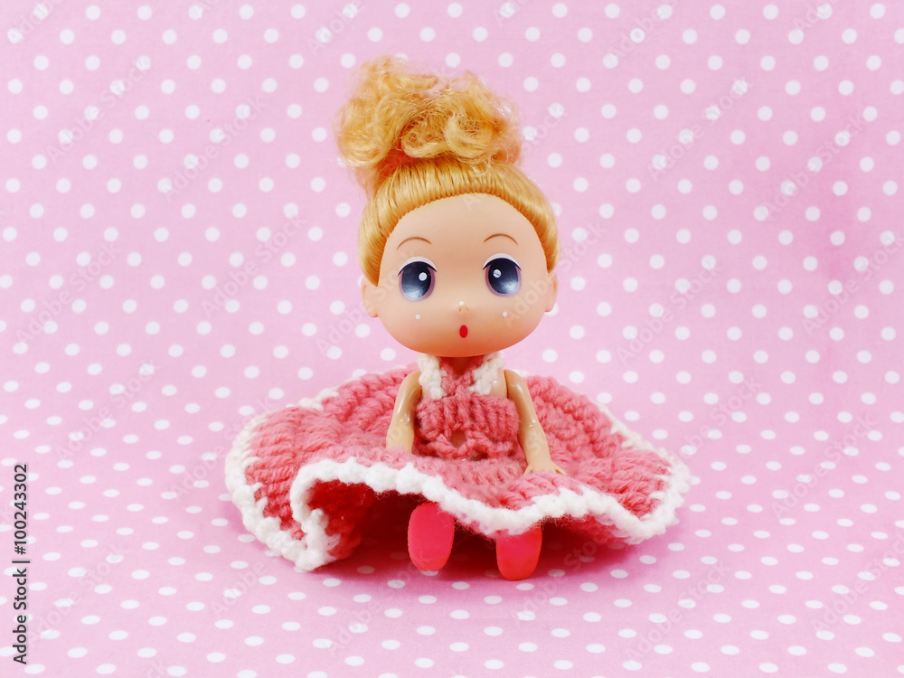 baby doll pink dress isolated on pink polka background