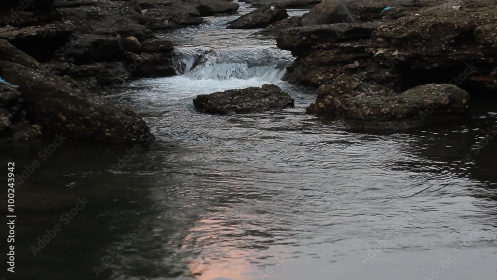 Mountain River with sunset glare on the water Mountain River with sunset glare on the water