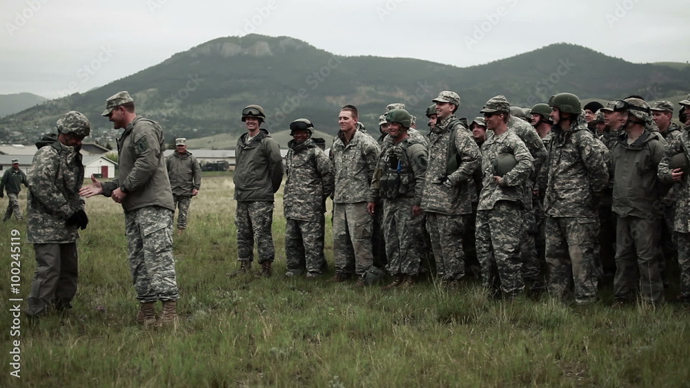 Soldier getting an award/promotion in the field. Soldier getting an award/promotion in the field.