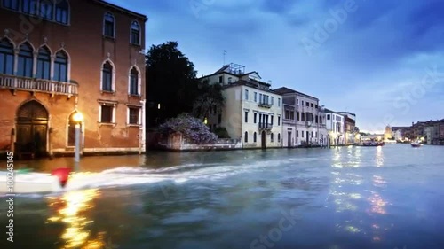 Tracking shot of happenings on the Grand Canal at dusk