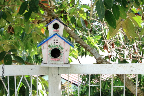 White Wooden Bird House On White Fence © afterman