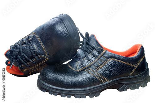 Black steel toe safety boots on white background.