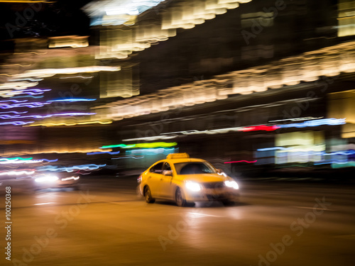 Yellow taxi cab at night