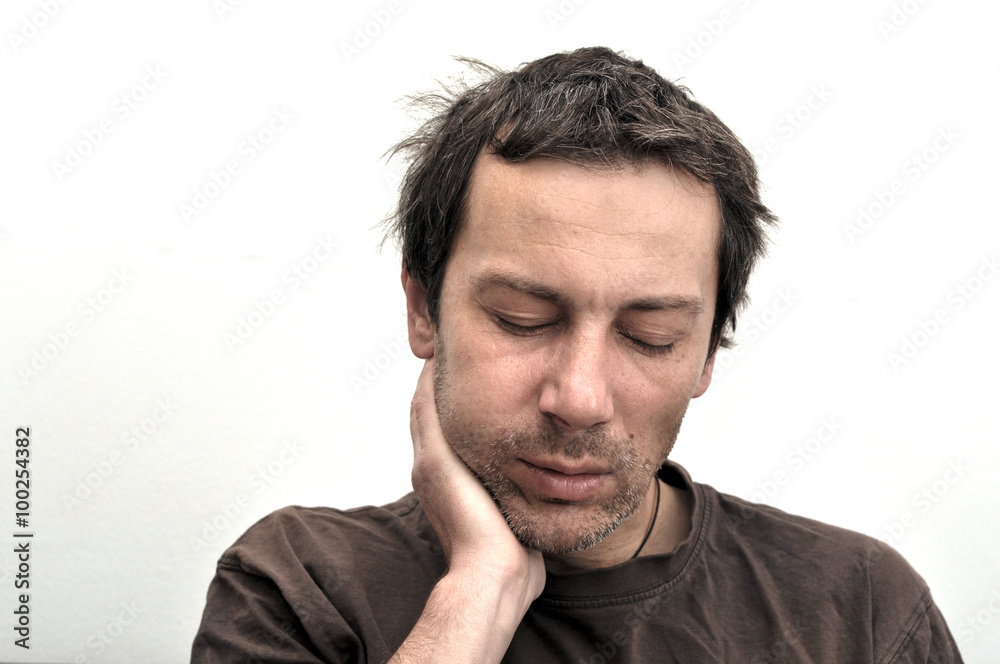 Man with swollen face suffering from toothache Man with swollen face suffering from toothache
