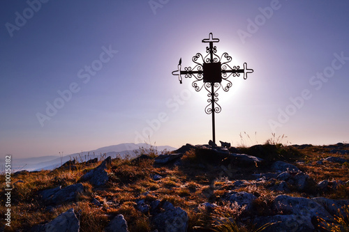 beautiful metal cross in the mountain