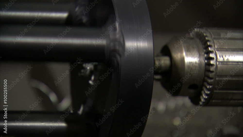 Drill that is stationary while metal spins around it. Drill that is stationary while metal spins around it.