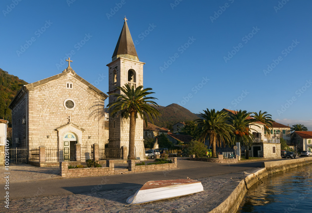 Church of Saint Roch and embankment of Donja Lastva village. Montenegro