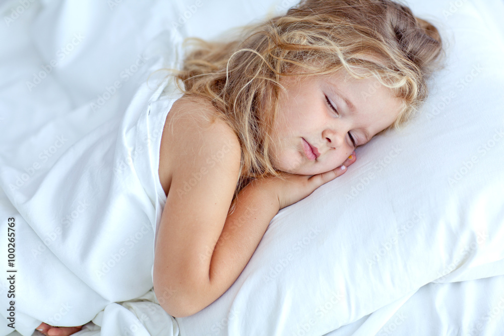 happy little girl in morning bed 