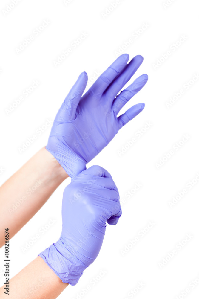 Doctor putting on protective gloves isolated Doctor putting on protective gloves isolated