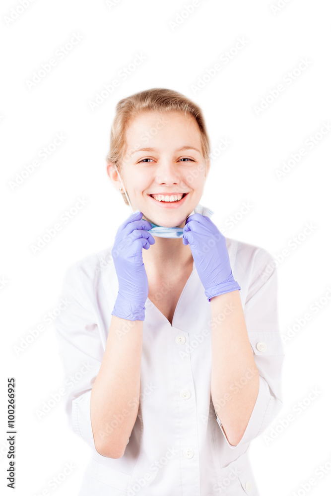 Smiling medical doctor woman taking off mask isolated Smiling medical doctor woman taking off mask isolated