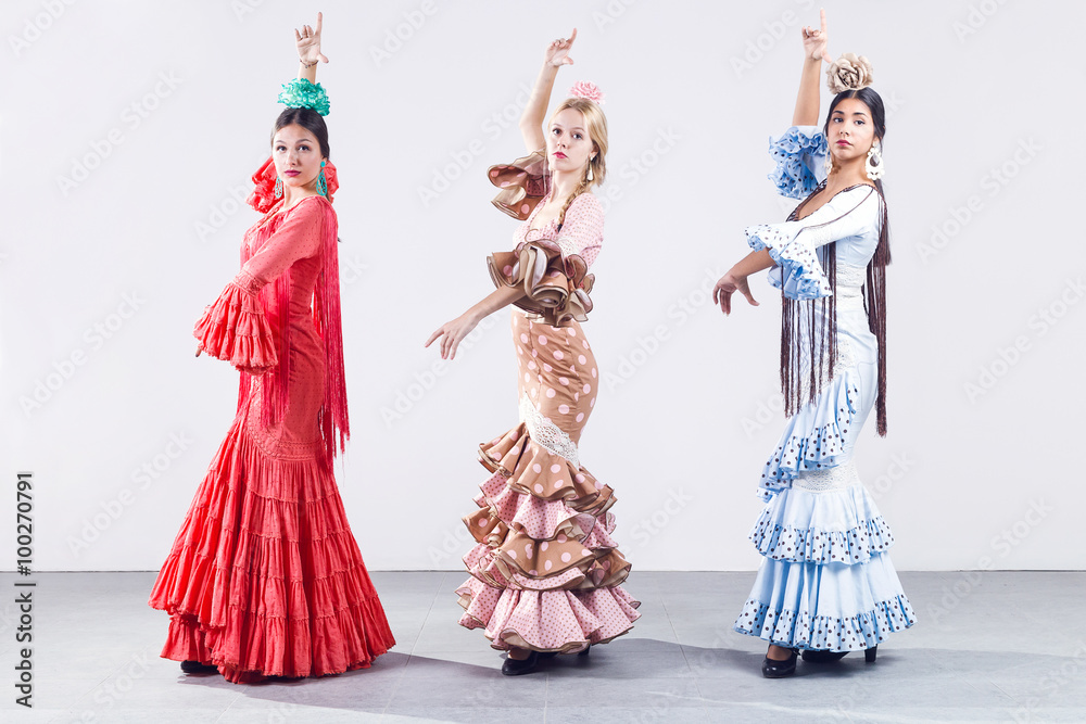Pretty three young flamenco dancer in beautiful dress. Pretty three young flamenco dancer in beautiful dress.