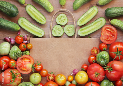 Still life with vegetables and a paper package, the top view.