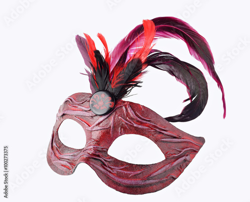 Venetian red Carnival half mask with feathers, isolated on white background