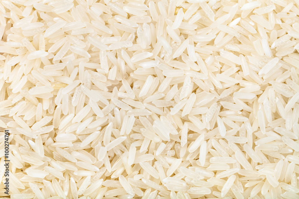 long grains of uncooked white jasmine rice