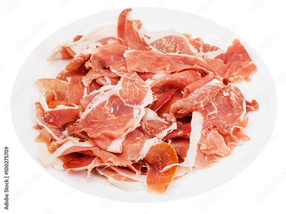 thin sliced jamon on white plate isolated